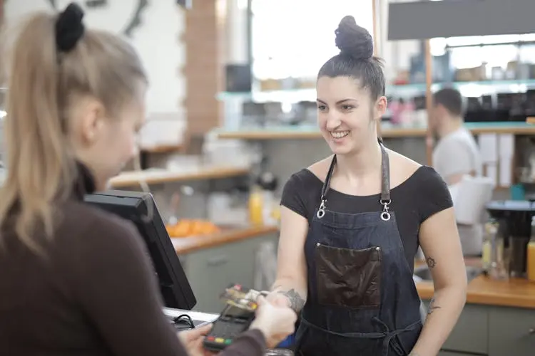 swiping card at a restaurant budget friendly dining